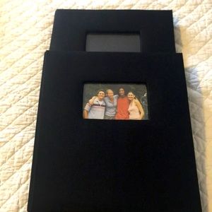 Two black heavy duty cloth photo albums
